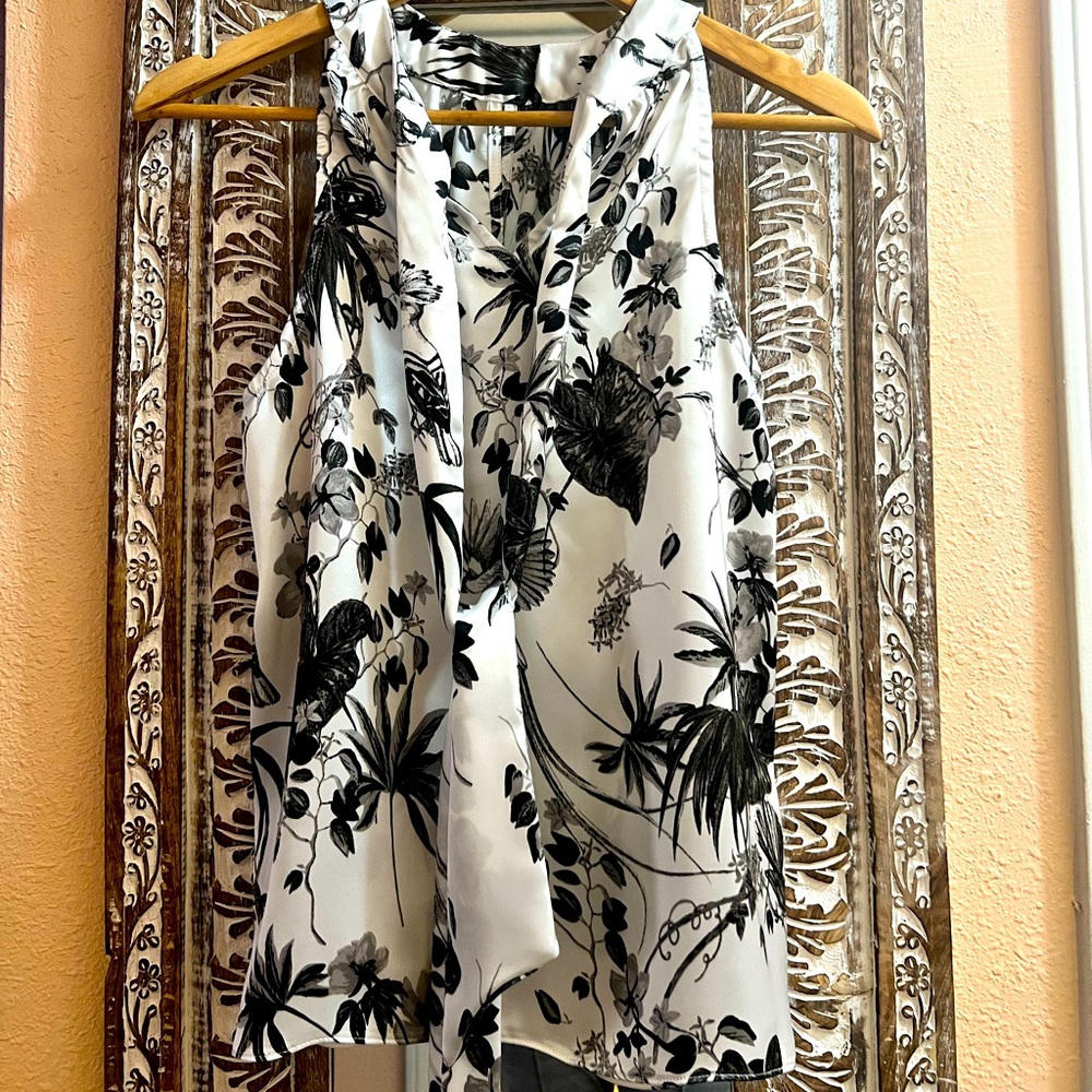 INC SLEEVELESS BLACK FLORAL DESIGN ON WHITE M SIZE BLOUSE. USED GOOD CONDITION